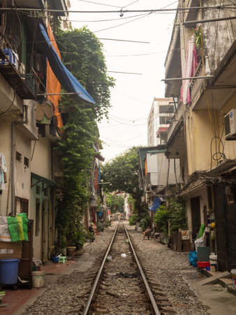 Local houses located close to active railway in Hanoi Old Quarter, Vietnam.のeditorial素材
