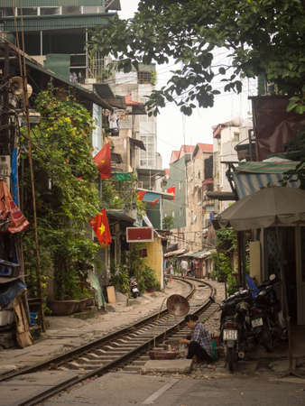 Local houses located close to active railway in Hanoi Old Quarter, Vietnam.のeditorial素材