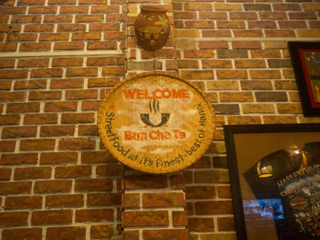 Welcome Label at traditional restaurant in Hanoi, Vietnamのeditorial素材