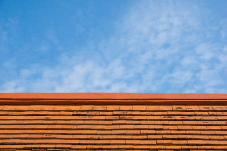 Red clay roof and blue sky.の写真素材