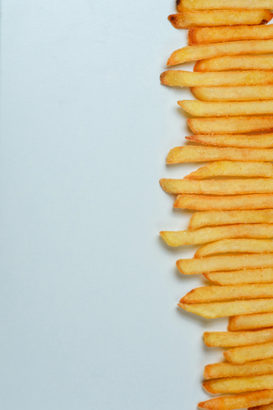 Top view of french fries on white backgroundの写真素材