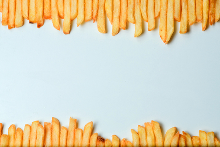 Top view of french fries on white background