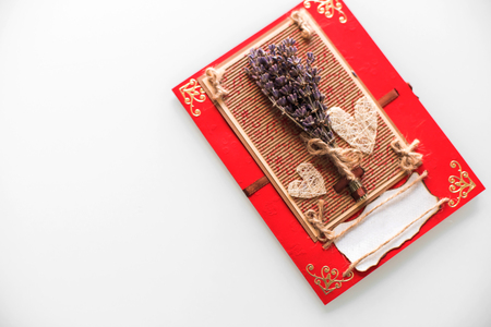 Close-up of a hand-made post card with lavender, hearts and copy space. Gift, Valentine, Christmas, Birthday, Holiday concept.の写真素材