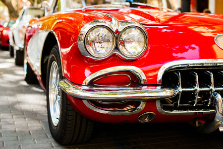 Close-up of headlights of red vintage car. Exhibitionの写真素材