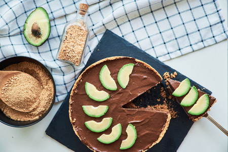 Top view of raw vegan chocolate avocado and banana cake. Healthy concept and vegetarian food.