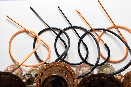 Top view of many hookahs with pipes isolated on white background. Shisha smoking concept.の写真素材
