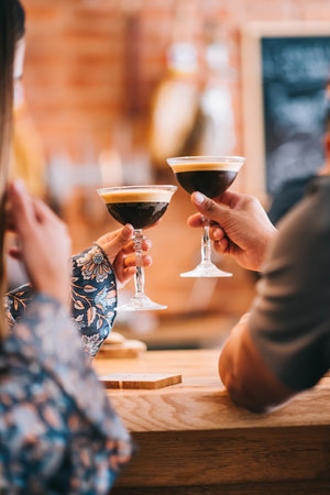 spanish girl holding cocktail in hand shallow depth of fieldの写真素材