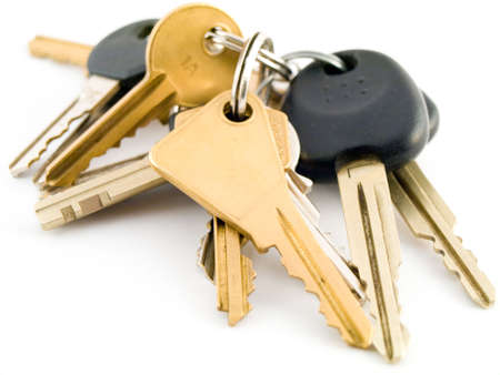 Set of  and Vehicle Keys on White Background