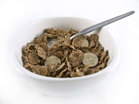Bowl of Credit Crunch Breakfast Cereal over whiteの写真素材