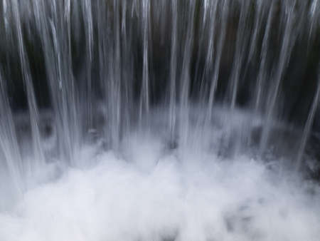 Streams of Cold Clear Water Pouring into Darknessの写真素材