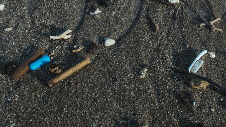 rubbish washed up on the beach in bali kutaの写真素材