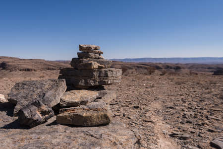 Rock Cairns along desert hiking trail, Namibiaの写真素材