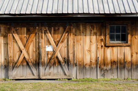 Exterior wall of old worn barn doorsの写真素材