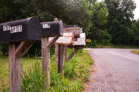 Row of unique mailboxes in rural USA town.の写真素材