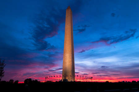 The Washington Monument lit up against a colorful sunset, Washington DC, USAのeditorial素材
