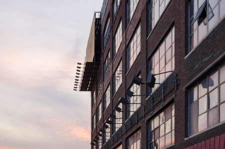 Abandoned warehouse facade with empty billboard, New Yorkのeditorial素材
