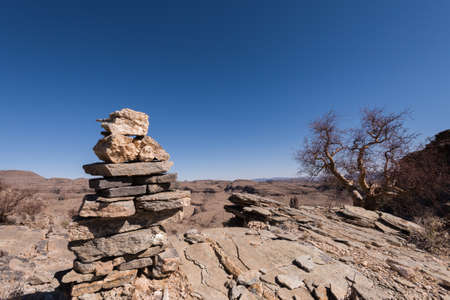 Rock Cairns along desert hiking trail, Namibiaの写真素材