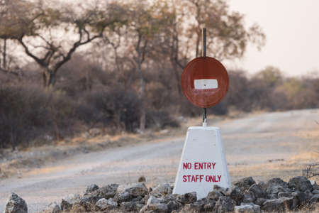 Hand painted no entry sign along road in Etosha National Park, Namibiaの写真素材