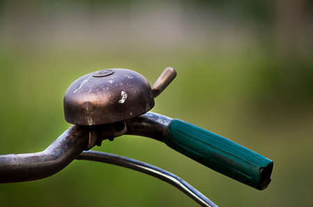 Rusty handlebar and bicycle bell close up (bicycle, vintage)の写真素材
