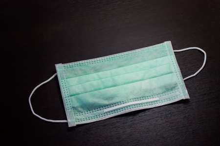 Protective mask on black background