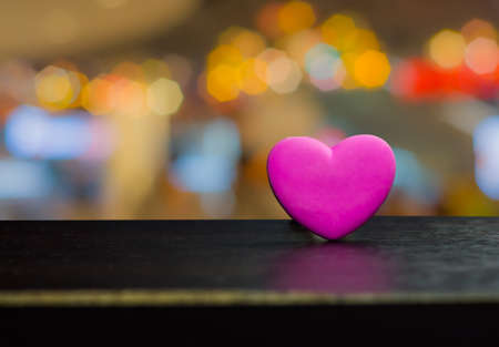 Pink heart-shaped chocolate gifts for Valentine's Day.On bokeh lighting backgroundの写真素材