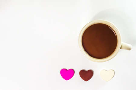 coffee cop and chocolate heart-shaped on white backgroundの写真素材
