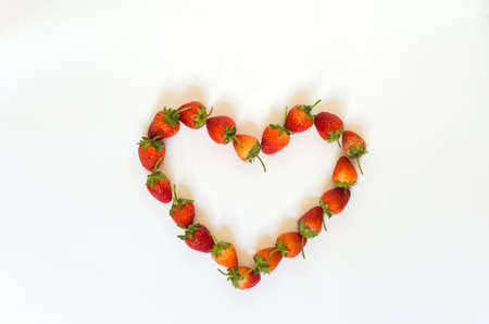 Strawberry heart-shaped arrangement.On white backgroundの写真素材
