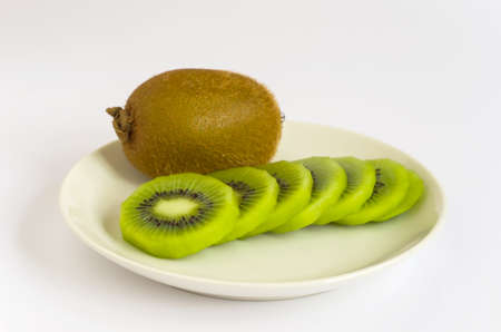 Kiwi fruit is sliced ââarrange them on a dishの写真素材