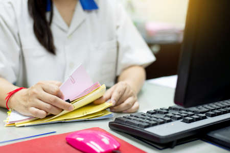 Employees are doing data in the office. Checking accounting information.の写真素材