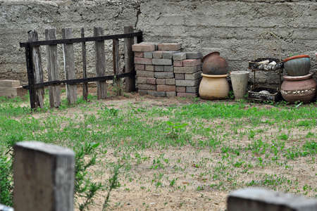 Back yard with a fence with flower potsの写真素材