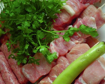 Parsley and paprika with mixed grill meat.の写真素材