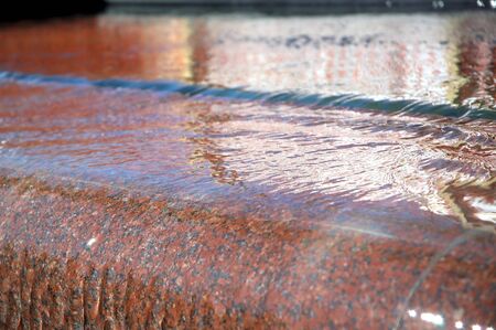 Water fall from fountain. Nice textured water and stone of the fountain.の写真素材