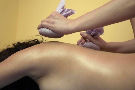 Girl relaxing. Massage salon with accessories. Anti stress massage.の写真素材