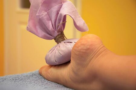 Girl relaxing. Massage salon with accessories. Anti stress massage.の写真素材