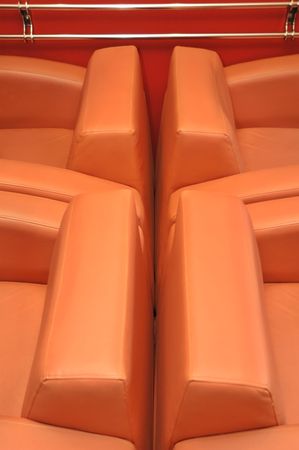 Interior of modern restaurant. Orange leather and luxury chairs.の写真素材