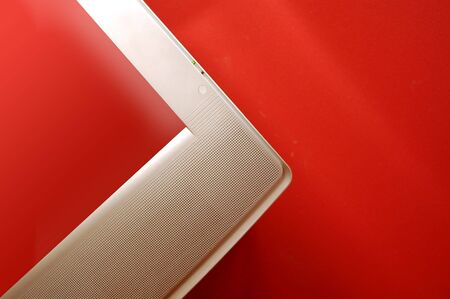 Pplasma TV with transparent screen on red wall.の写真素材