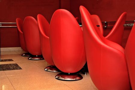Interior of modern restaurant. Red leather and luxury chairs.の写真素材