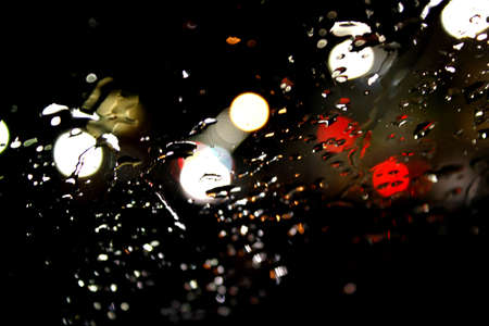 Bokeh rain night day with raindropsの写真素材