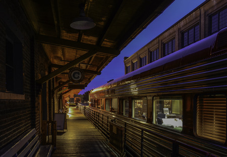 Railroad Depot And Modern Train At Eveningのeditorial素材