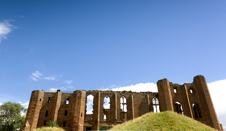 Kenilworth castle ruins in Warwickshire, England with blue sky backgroundの写真素材