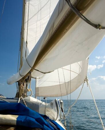 sails from a yacht sailing on calm sea