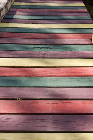 multi coloured wooden footpath in pastel shadesの写真素材