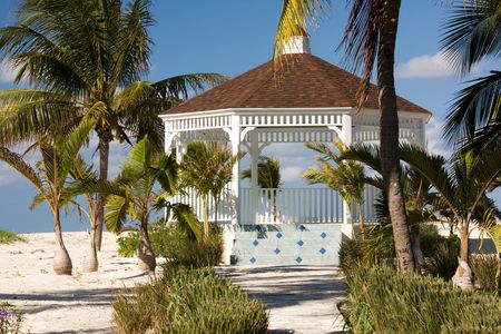 wedding gazebo surrounded by tropical palm treesの写真素材