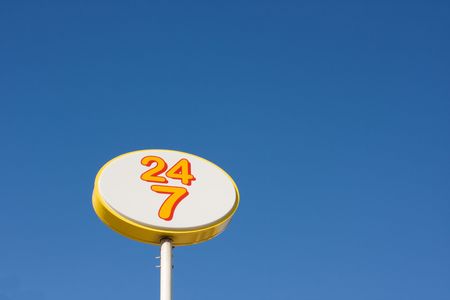24 7 always open yellow and white signの写真素材
