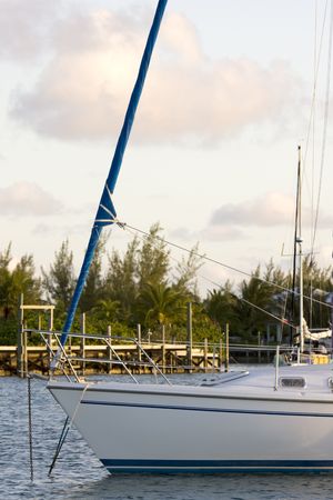 bow of yacht at anchor in the evening