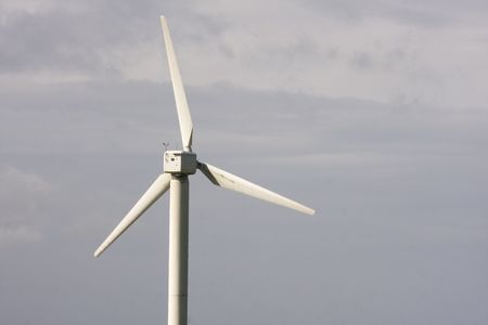 wind turbine electricity generator towers in summer