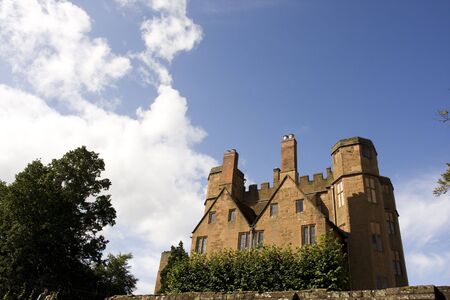 main house of castle ruins agains sky backgroundの写真素材