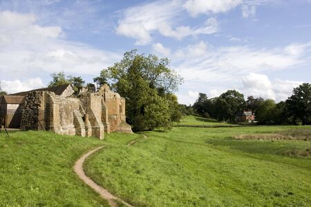 footpath along side of wall of castle ruinsの写真素材