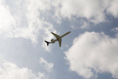 jet passenger aircraft taking off into a summer sky