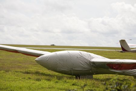 glider stored on an airfield with cockpit coverの写真素材